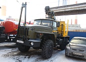 Лесовозный тягач Урал 55571 с манипулятором ОМТЛ-70.02